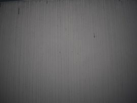 Residents' homes and pools have been dyed black by the soot from the fire. Lourens' walls have all got black streaks running down them.