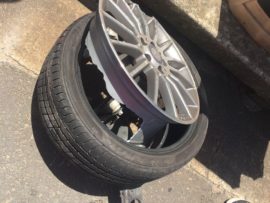One of the vehicles lost a rear wheel in the side impact collision.
