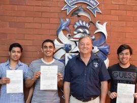Essop Ahmen Farhaan, Yashil Morar, and Nabeel Hussain pictured with Northwood School's acting headmaster Mark Rich.