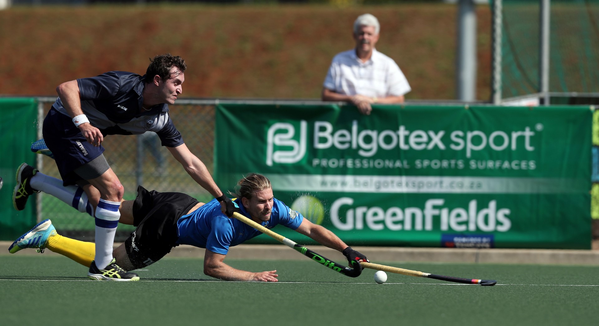 SA and Riverside Hockey Club player, Taine Paton, makes a diving attempt to disrupt Old Albanians counter attack in the 2017 Belgotex Elite Club Challenge. PHOTO: Steve Haag