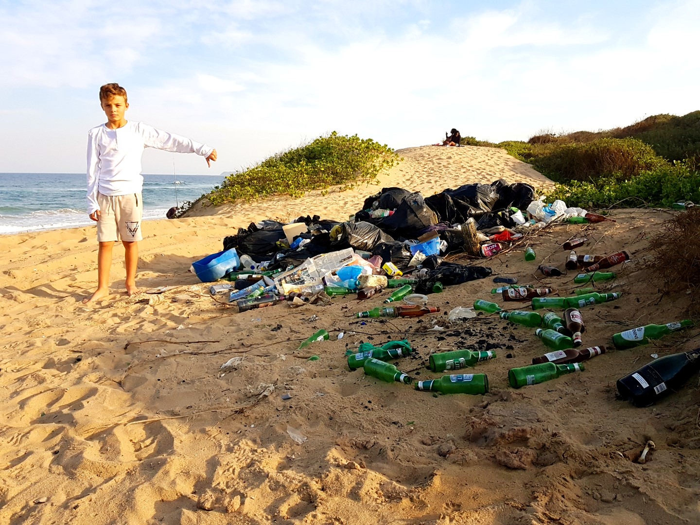 Tyron Nel gives the rubbish left on Beachwood Beach the thumbs down. Illegal dumping have raised the ire of residents in the area.