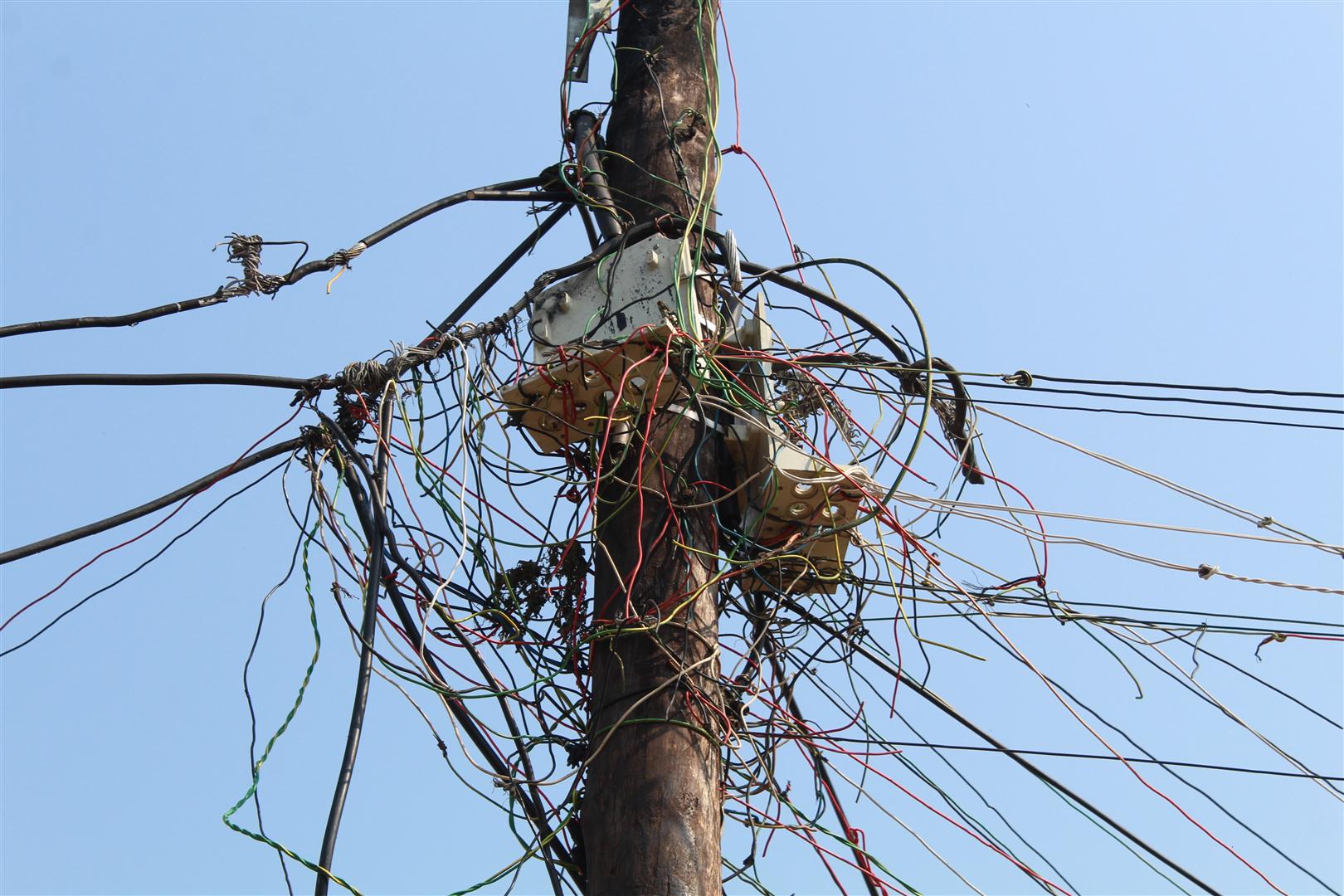 Illegal electricity connections is one of the main issues facing the community. Here the wires are connected to what was a street light.