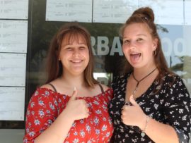 Durban North College learners, Megan Fuchs and Holly Armstrong give their results the thumbs up.