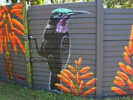 The wall features a male and female Amethyst sunbird with krantz aloes forming the background. The birds pollinate the aloes and feed off it.