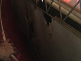 One of the damaged sections at the shelter where the board has been broken off.