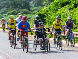 The hand-cyclist category continues to be a popular one as Ari Seirlis (pictured on handcycle) rides his way along at the aQuellé Tour Durban.