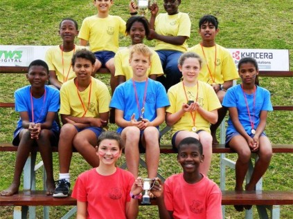 Southcity pupils proudly display their medals and trophies (front, from left): Sian Koekhoven and Mvelo Duma (Asher House captains with the Spirit Cup), (second row) Pumelela Shezi (U11 winner), Kesley Cotton (U11 winner), Hayden Wood (U10 winner and junior victor ludorum), Morgan Broome (U10 winner and junior victrix ludorum), Hannah Nero (U12 winner), (third row): Khayalethu Mngadi (U13 winner), Olwethu Ndzakayi (U13 winner and senior victix ludorum), Cameron Krishna (U12 winner &
