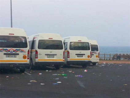 The parking area is covered with garbage that could potentially end up in the ocean.