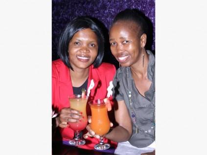 Raise a glass: Toasting to the new Lighthouse Festival are Elizabeth Madeya (left) and Nthabiseng Tshabalala. The festival launch party took place at Stages restaurant in Port Shepstone last Wednesday. 0167vee