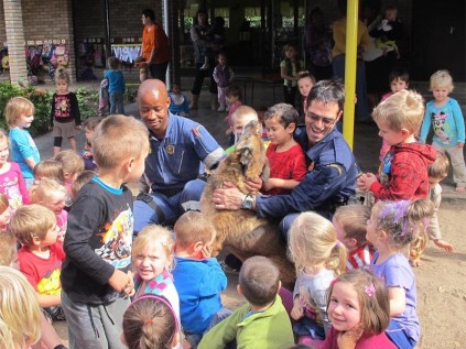 Sgt Joseph Cele (left) and Sgt Rommel da Rosa from the K9 Search and Rescue unit, Port Shepstone visit Pikkie Pre-Primary recently.