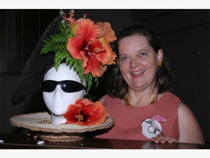 Francis Maher demonstrates how to create a fancy hat at Stonecroft Ministries' recent meeting.