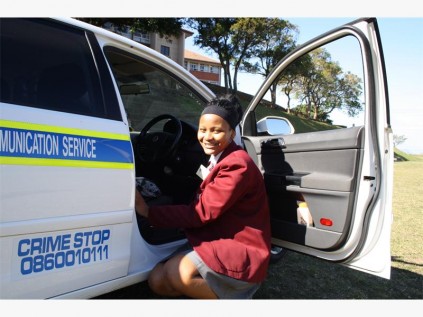 Port Shepstone High pupil Avuzwa Melane searches for a packet of dagga hidden in a police vehicle. The task demonstrated to pupils just how fast a police dog can track down hidden drugs.