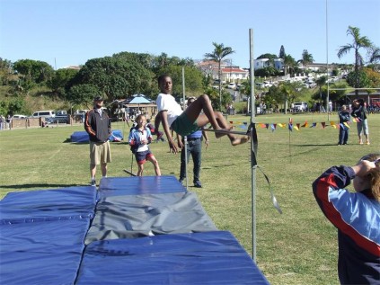 Margate Primary pupil Thando Mqhatu sails over the bar in the boys' U13 high jump.