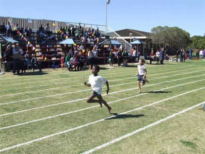Olwethu Ncama springboards the record-breaking girls' U9 4x100m relay for Margate Primary.