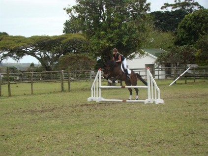 Up and over: Cheryse Faddy, on Royal Thunder, completes a training session under the tutelage of Jodi Pieters.