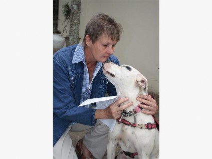 Yvonne Els and Patch wait to receive a blessing from Reverend Joan Parker.