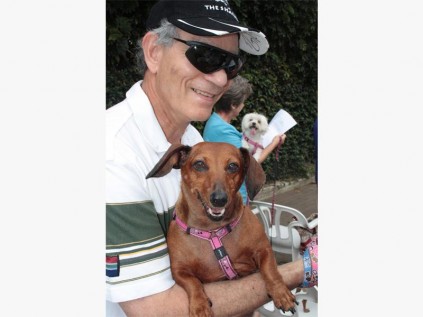 Edgar Cook and Lilly at the pet blessing service.