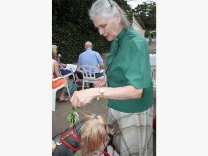 Reverend Joan Parker blesses a pet.