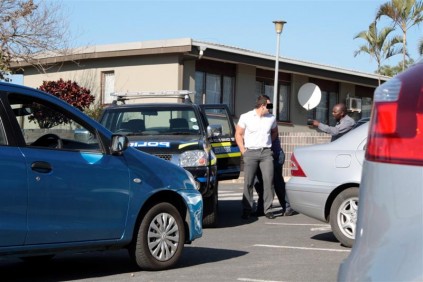 Police arrest one of the alleged bullies at the school.