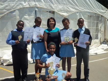 Hlanganani award winners (back, from left) Thabiso Zondi (sportsman), Nandipha Mabindisa (sports girl), Helen Wiggett (gr 7 teacher), Nolwazi Mfeka (most diligent), Mesuli Miya (best achiever) with Sithembile Ngcobo , the dux award recipient, in front.