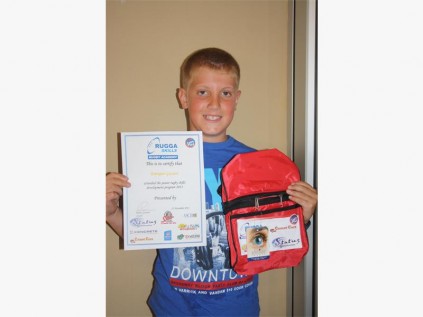 Pleased with his award is Enrique Goosen, at the Rugga Skills Rugby Academy's prize-giving held in Margate last Saturday.