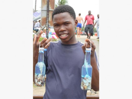 Sbonelo Zondi sells these unique handcrafted bottles at Hibberdene beach.
