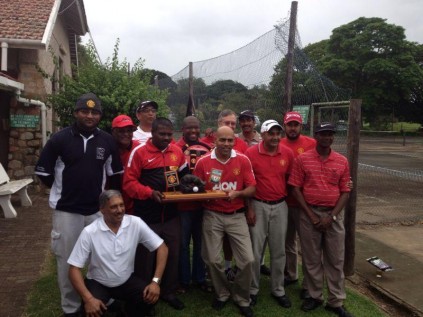 The local Manchester United supporters' team celebrates yet another win over their Liverpool counterparts. They are (back, from left) Sashen Govender, Ronnie Naidoo, Nathan Appalraju, Emmanuel Mseleku, Bevis Fairbrother of co-sponsor South Coast Herald, Collin Moodley, Pravesh Govender, Brennan Raymond, Justin Naidoo, with Rajen Chetty and Sharms Goberdan holding the trophy and Dr Devan Appalraju kneeling.