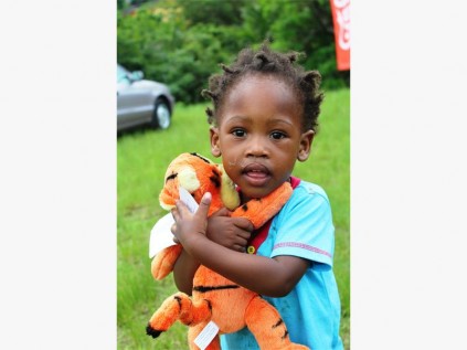 Princess Shabangu is overjoyed with her Christmas present. Photo by Luané van der Walt