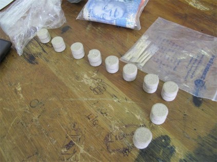 The confiscated drugs and money. 