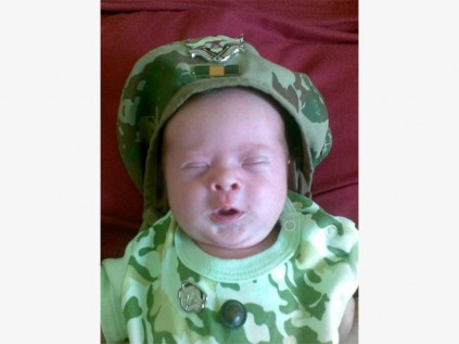 Little Anthony Robert Emmerson would have made his daddy Clive very proud, especially wearing his camouflage outfit with daddy's 32 Battalion beret.