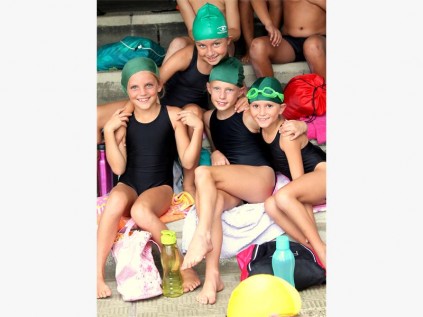 Izotsha Primary pupils (from left) Emily Bezuidenhout, Daisy Pybus, Nicole Elam and Hailey Bezuidenhout stand united in their support for their team at the gala last weekend.