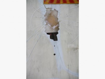 The man responsible for setting the car alight also broke this window in Flamingo Avenue.