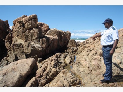Police spokesman, Captain Gerald Mfeka, at the scene where Edna Fourie's body was found by a beachgoer last week.