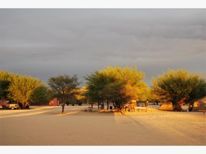A strange light signals the approching storm at Nossob camp.