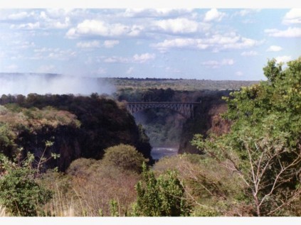 A view of Victoria Falls Bridge and the 'smoke that thunders', from the iconic Victoria Falls Hotel.
