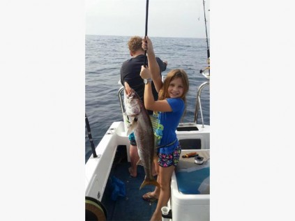 Jenna Smith with the geelbek she caught fishing from her father Digby's boat 'Game On'. SUBMITTED