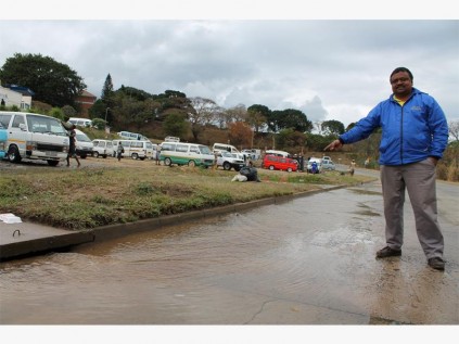 Councillor Ajith Rajaram of Ward 17 shows how water gushes down this stormwater drain in Dick King Road, Port Shepstone.