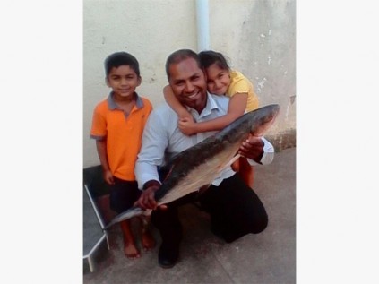 Rishard Hoosen of Port Shepstone shows off the 13kg garrick he caught at Port St Johns recently. With him are his daughter Suhayla and nephew Uzai Maharaj. SUBMITTED