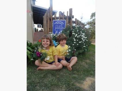 outhcity pre-primary pupils Kaitlyn Ramos and Jack Chapman remind everyone about the school's annual Spring Walk this Sunday.