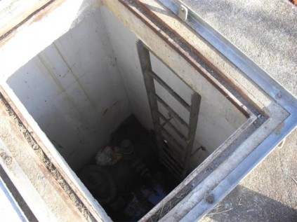 Strategic water controls and valves at the Ramsgate reservoir are submerged in water.
