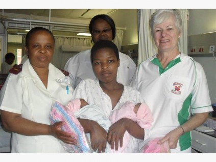 MBC bowler Wendy Walker (right) hands out baby clothes and blankets to mothers at Murchison Hospital. MBC and RSC women are on a huge drive to help mother's clothe their new babies and appeal to the public for donations of wool and other goods.