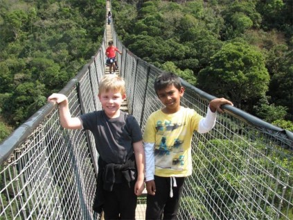 Wesley Francis (left) and Jadyn Kenneth bravely walk across the swing bridge.