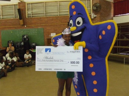 Sam the Southcoast Mall Starfish hands over the first prize to delighted Margate Primary pupil S'thabile Xolo for winning the recent 'Draw your happy place' competition.
