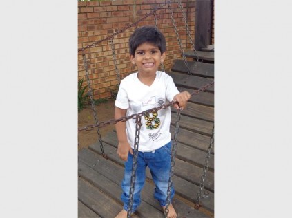 Creston pre-primary pupil Zyev Mahadev tries out the clatter bridge on the first day of school.