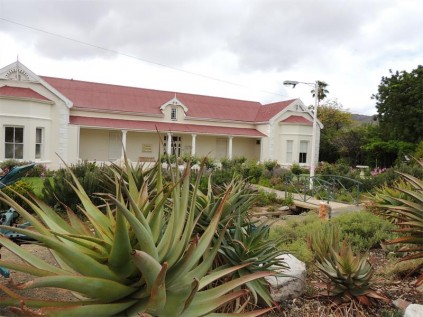 Pretty gardens complement the lovely old building housing the Francie Pienaar Museum.