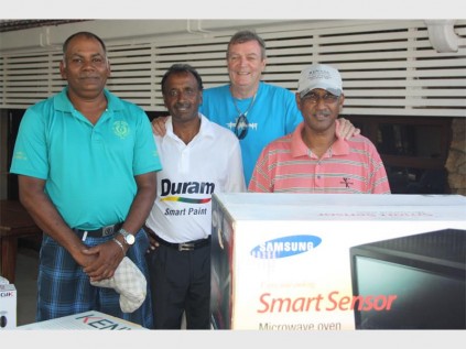 Pleased: Club president John Beekman (back) congratulates the winners of the Luckys Golf Day at Port Shepstone Country Club last Saturday, Abel Yeeranna (left) and Pete Govender. With them is runner-up Peppy Govender, whose partner Dr Ayoob Bux was absent for the photo.
