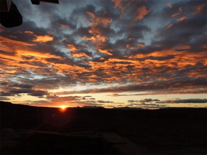 The sinking sun sets the sky on fire.