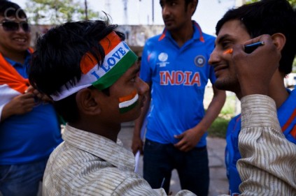 India - Mohali - Cricket fan having face paint applied