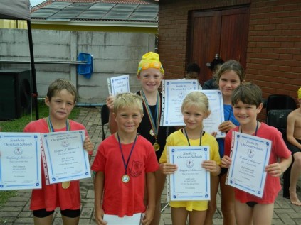 Junior primary swimmers (from left) Seth Simpson (U8), John Greyson (U7), Caitlyn Peckham (U9), Leah Scott (U7), Kiara Young (U8) and Rafe Drummond (U9) all received certificates for being age-group winners at last week's annual swimming gala.