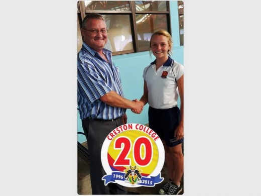 Headmaster of Grantleigh Junior School, Colston Veater congratulates Creston College U13 swimmer Tannah Caldwell. The Creston senior primary team won the Durban and district gala in Durban last Thursday.